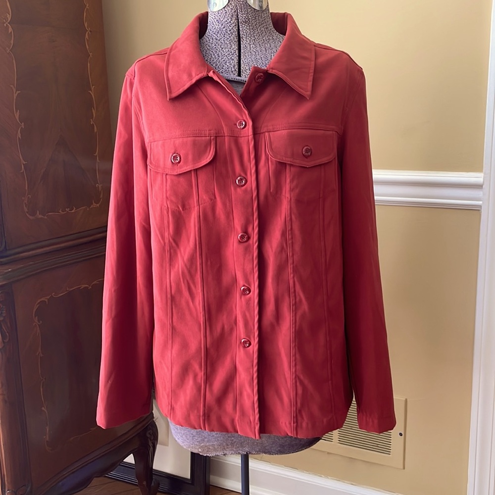 Burnt red button down with front pockets.